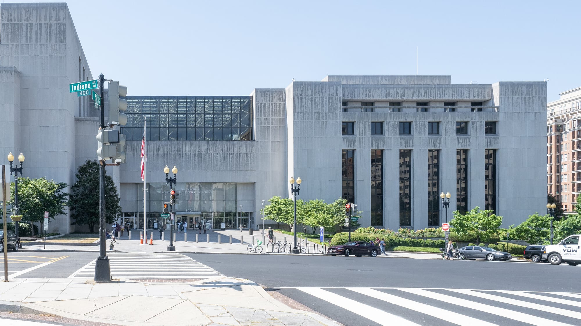 A grey exterior of a building on a sunny day.